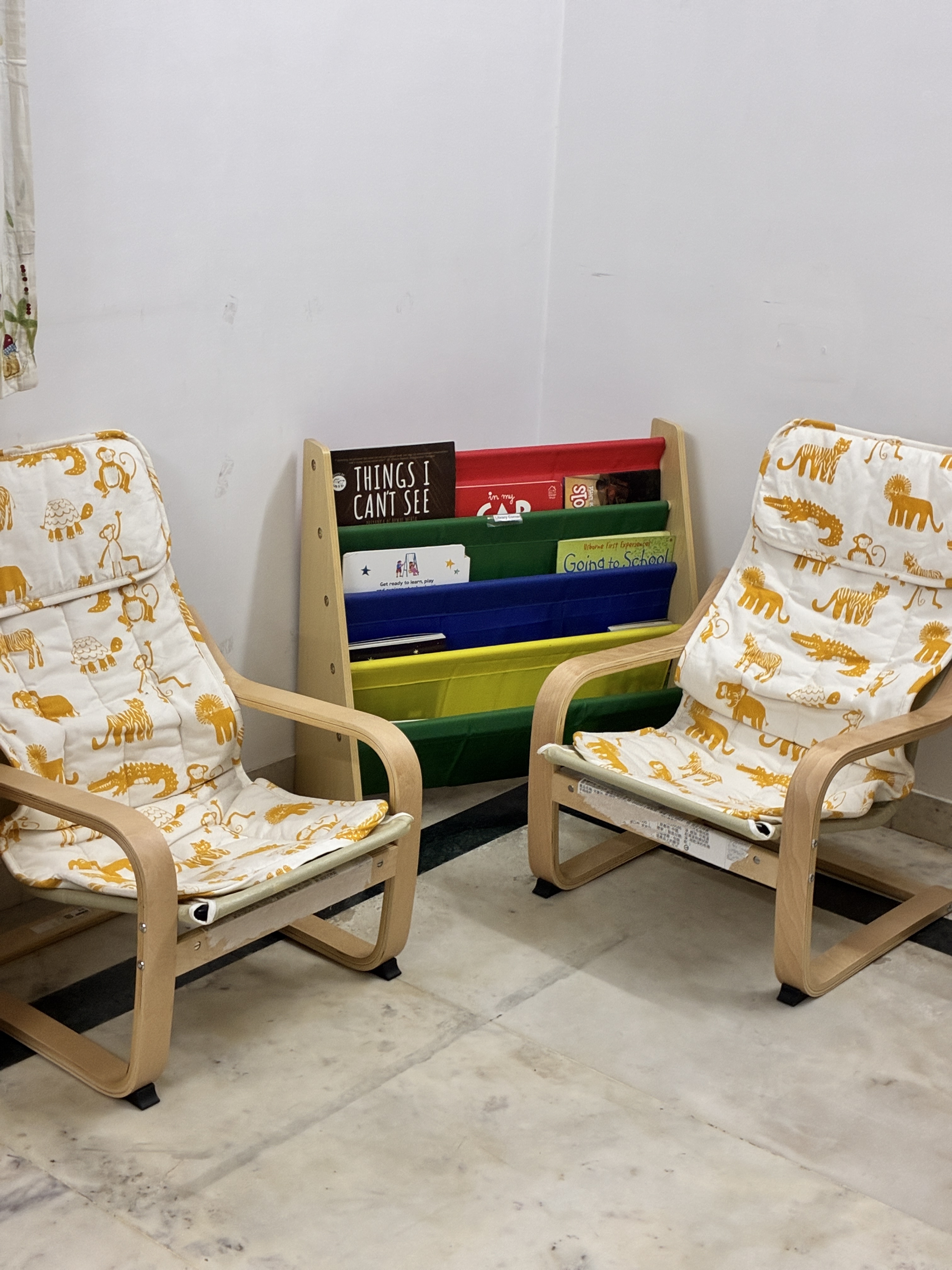 Cozy reading area chairs and book stand