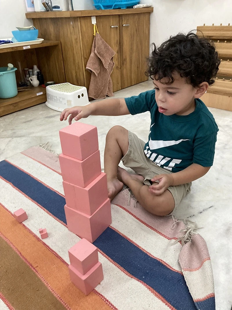 Child building words using the Large Movable Alphabet layout